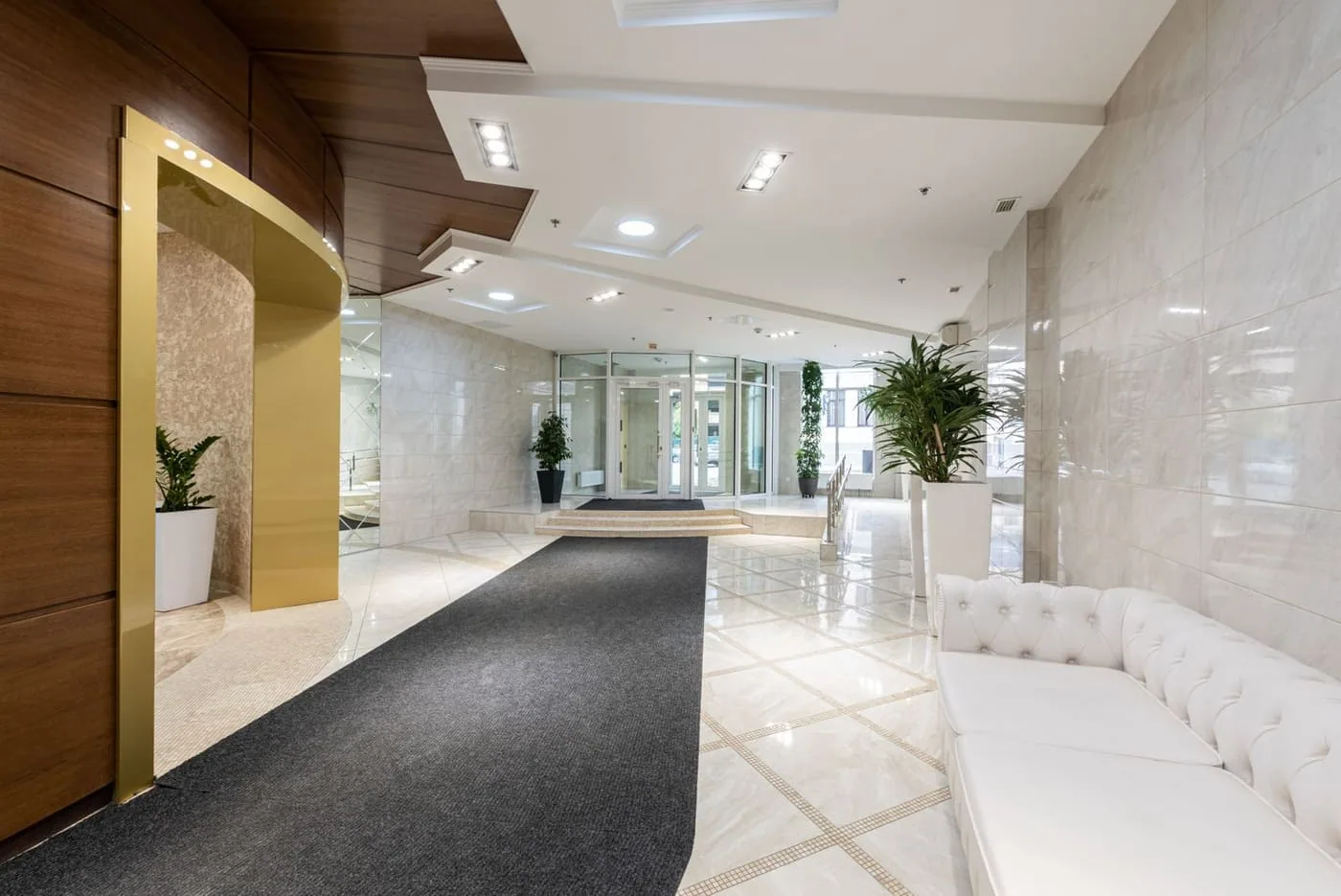 A modern building entrance lobby with a controlled entry