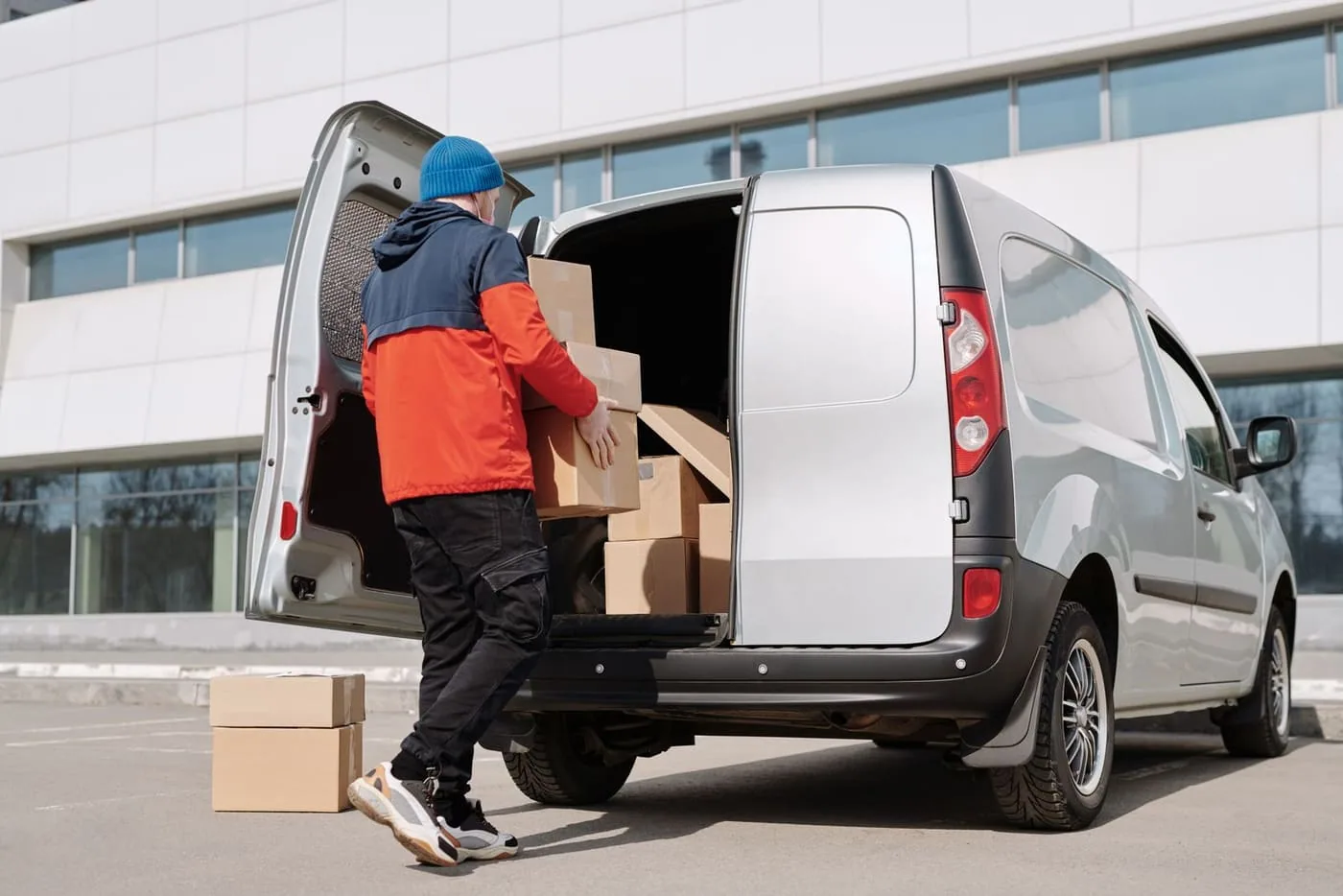 An operator loading boxes into a service van