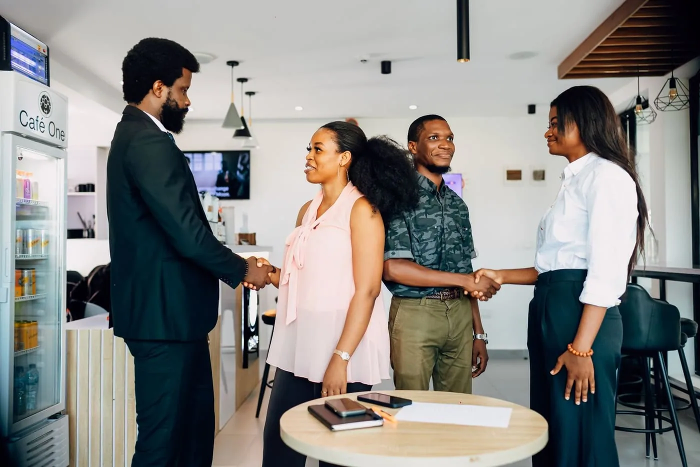 A location team and an operator meeting in a shared space